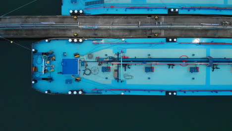 Blue-oil-river-barge-stationary-filmed-from-above-30fps-4k