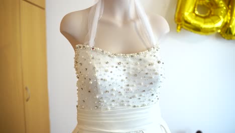 bridal dress fitting at a cozy venue with elegant décor and joyful celebration atmosphere