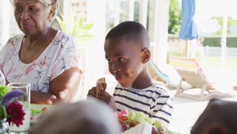 Video-of-african-american-family-spending-time-together-and-having-dinner-outside