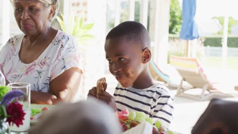 video of african american family spending time together and having dinner outside