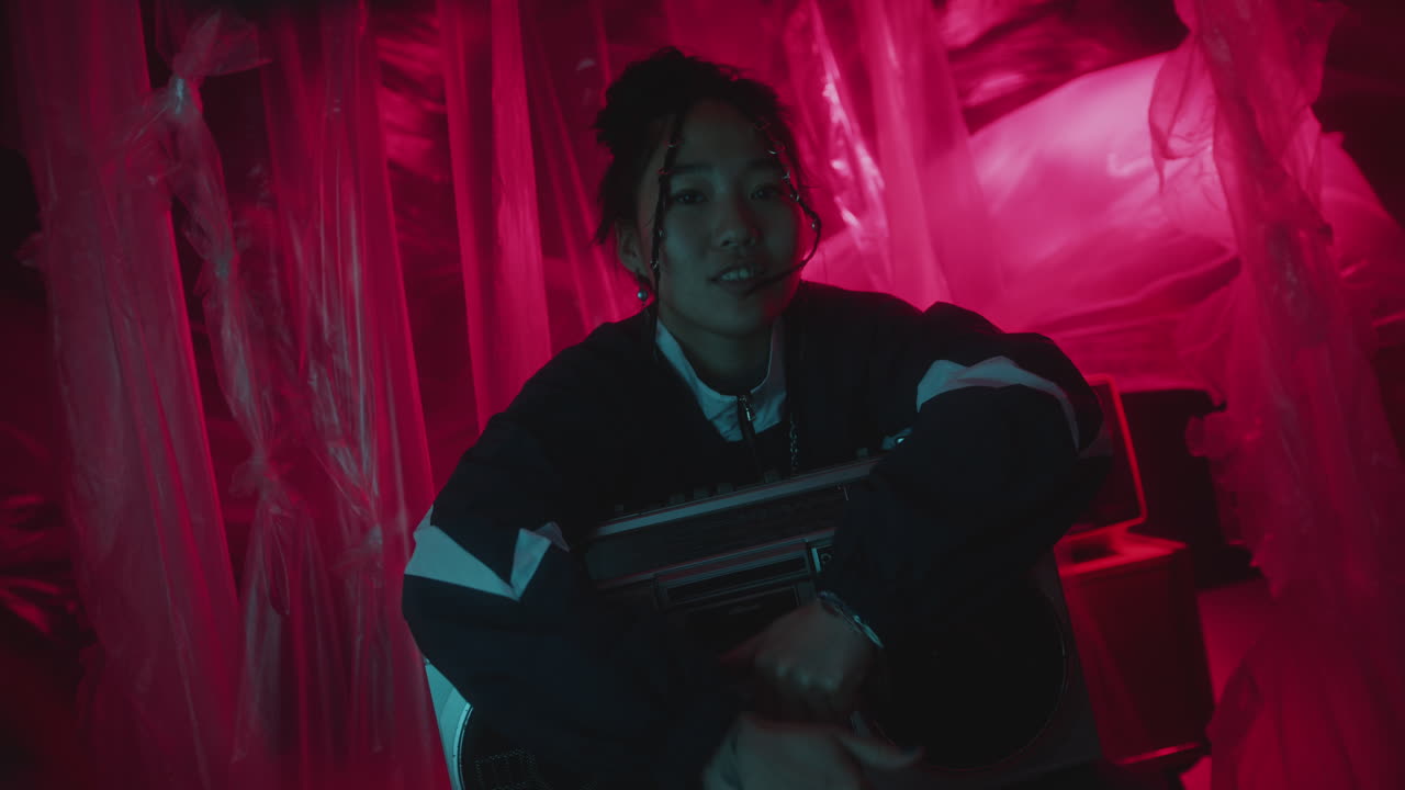 Cheerful Asian Girl in 90s Tracksuit Enjoying Music on Retro Cassette Player