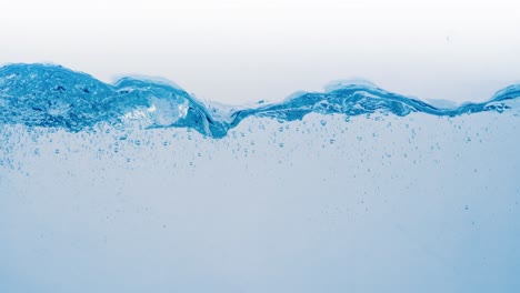 Many-bubbles-in-water-close-up,-abstract-water-wave-with-bubbles-in-slow-motion