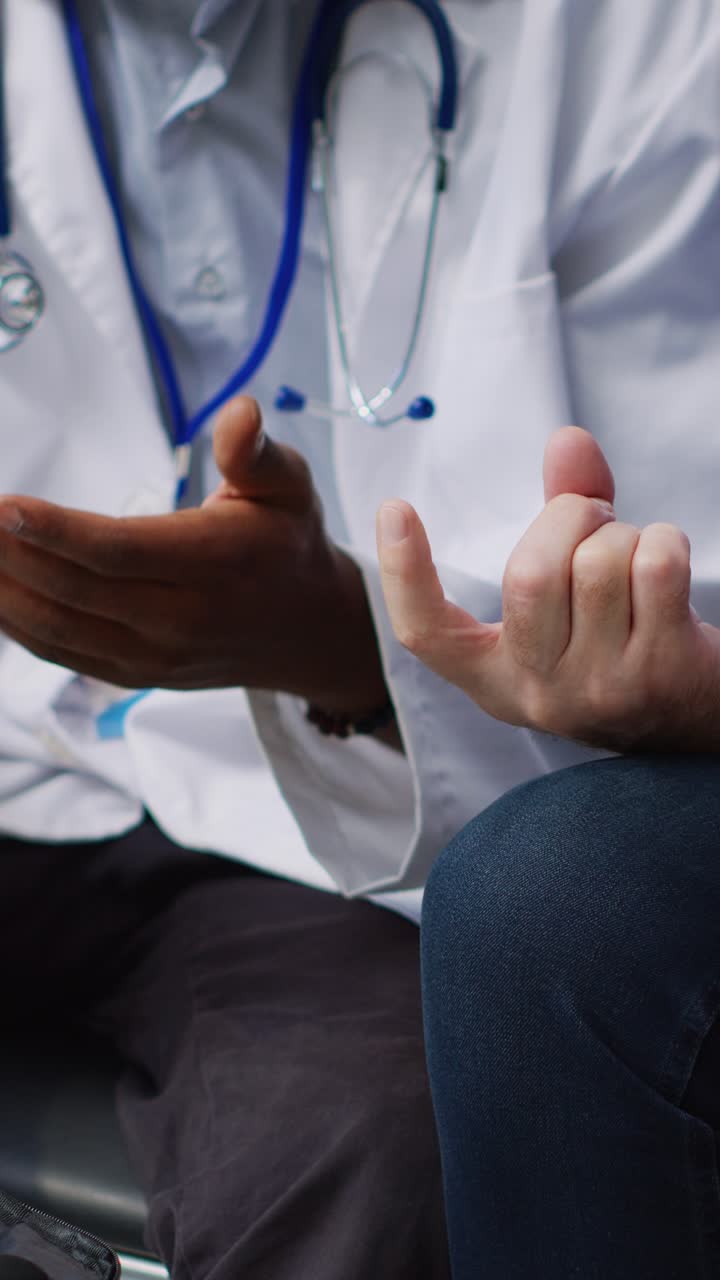 Vertical video: African american doctor doing medical test