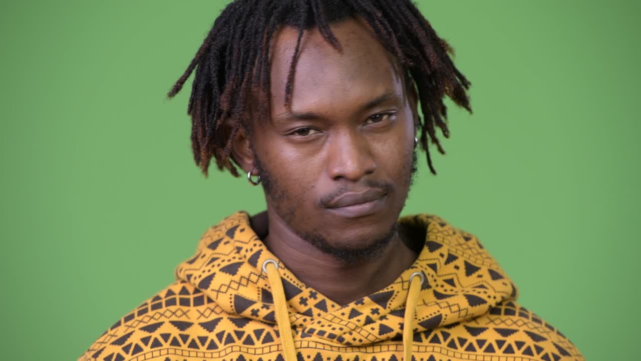 Young handsome African man nodding head no