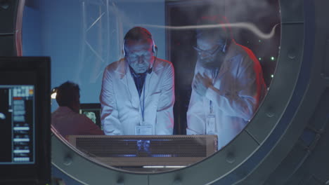 scientists in a high-tech control room
