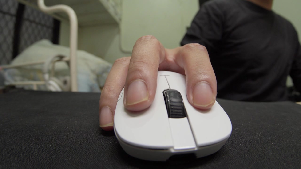 Close Up of Hand Using Computer Mouse on Desktop at Home, Fisheye Lens View