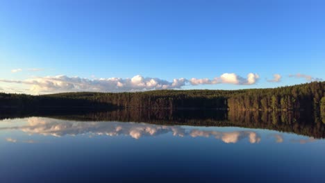 tranquil lake scenery by sunset golden hour in the wilderness