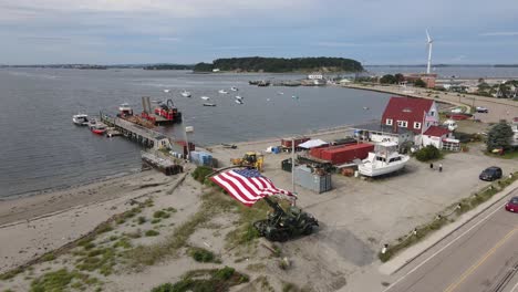 horizontal american flag blown by the wind at the coast