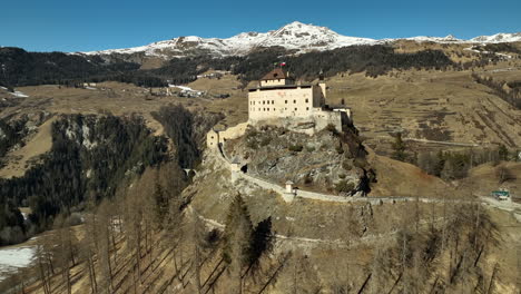 schloss tarasp on a sunny day in winter time in switserland