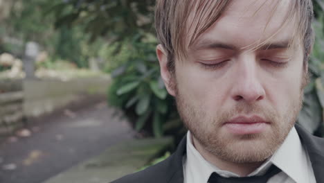 sad man sitting on bench, close up