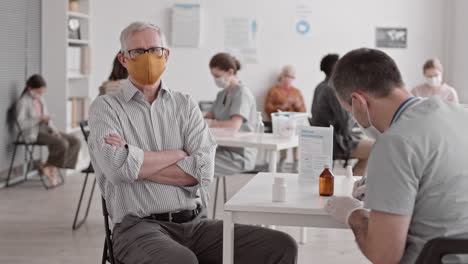 man posing at appointment with doctor