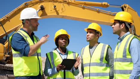 a diverse construction crew, including a woman with a tablet, discusses plans, construction crew
