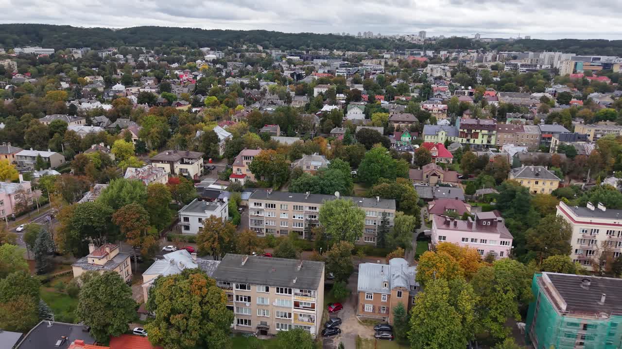 Aerial View of Residential Cityscape with Green Trees and Houses
