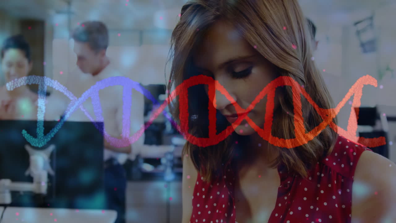 DNA strand animation over people working in modern office environment