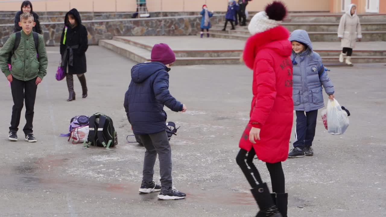 School Children Playing Outside in Winter