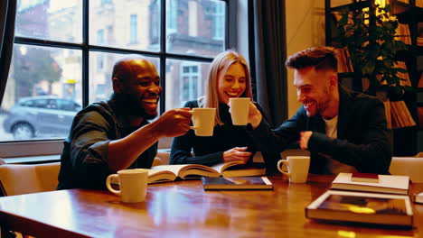 friends enjoying coffee in a cozy library cafe