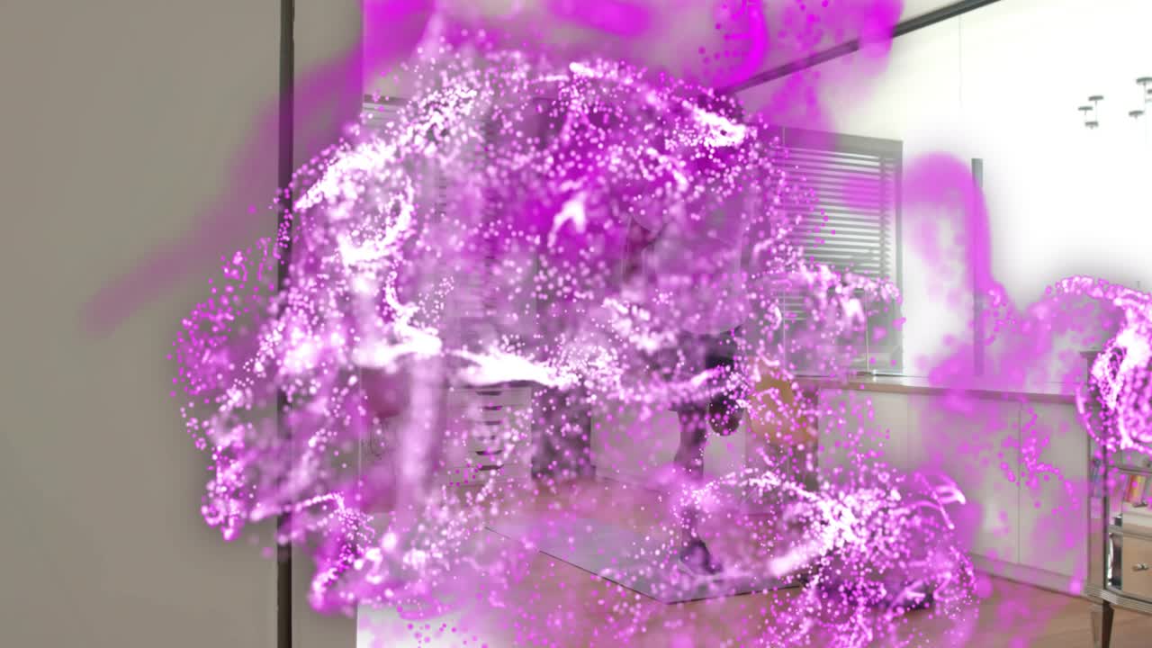 Man holding yellow cloth by counter while left purple swirl growing over man, showing tech graphics