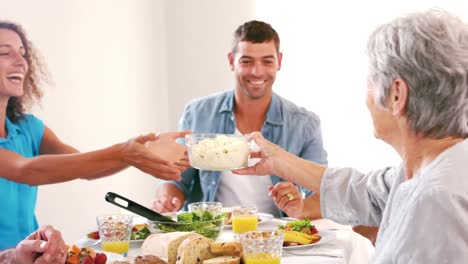 Cute-family-having-lunch-on-the-table