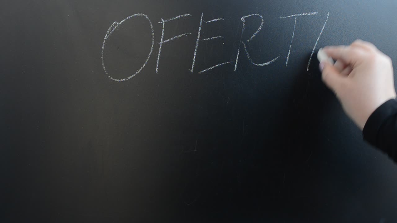 Discount text on a board. We write with chalk on a board