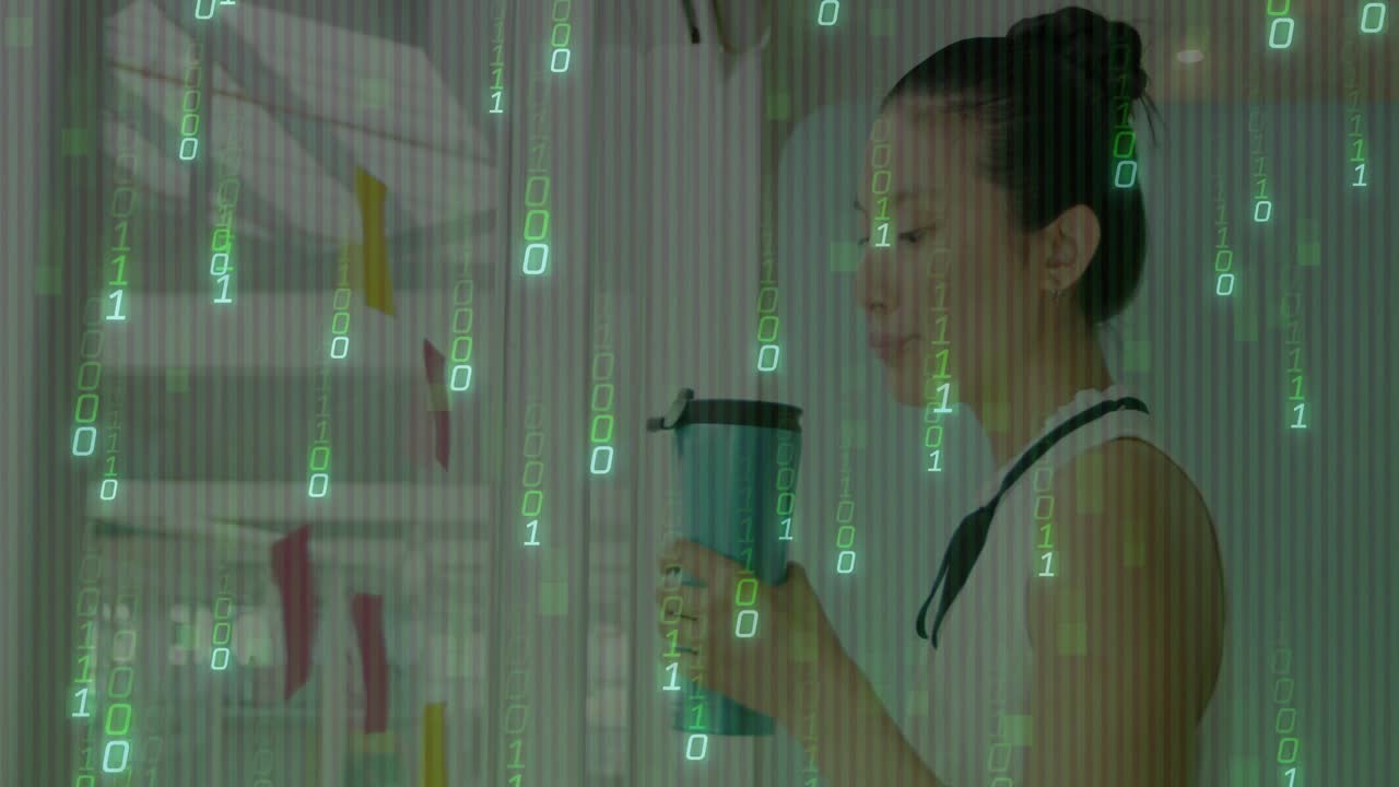 Woman raising mug, donning eyeglasses, peeling pink sticky note from office glass wall for review