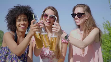 young women clinking beer