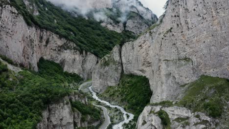 mountain valley with winding road and river