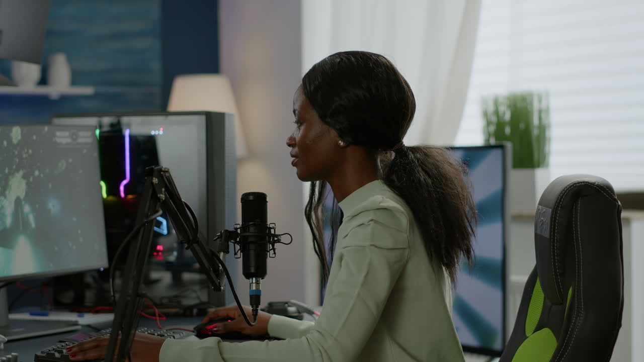 Portrait of concentrated african gamer looking at camera smiling,