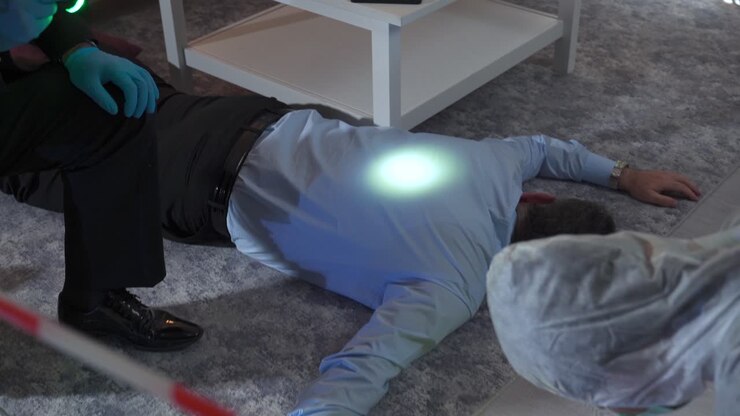 Forensic criminologist and professional detective working at the crime scene.