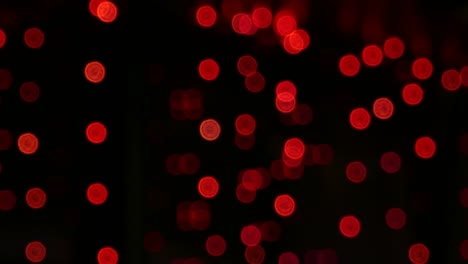 footage of red bokeh lights out of focus