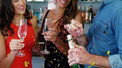 popping champagne and celebrating, people surrounded by confetti animation