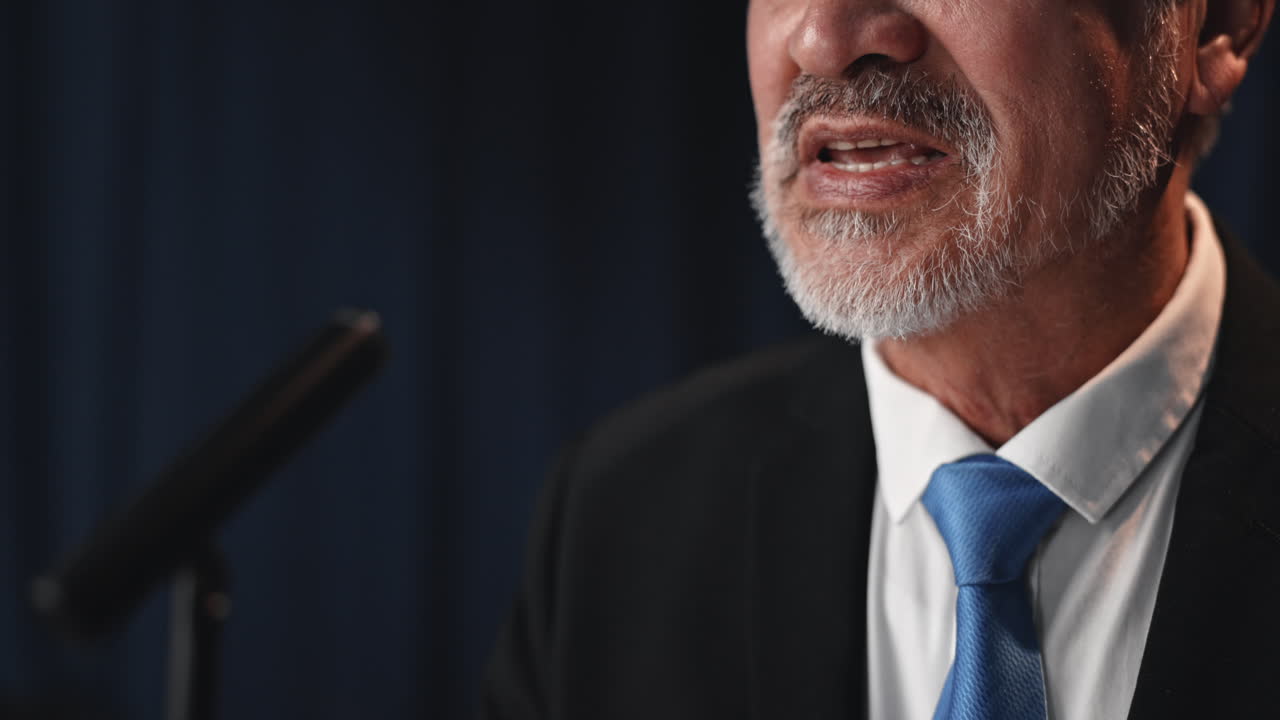 Man speaking at a lectern