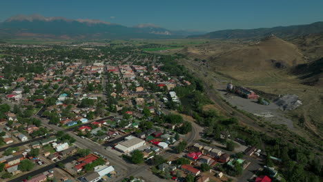 Salida-Colorado-aerial-cinematic-drone-mid-summer-downtown-S-Lime-Mill-near-Buena-Vista-on-Arkansas-River-Riverside-Park-Scout-surfing-wave-biking-hiking-rafting-Rocky-Mountain-forward-slow-pan-motion