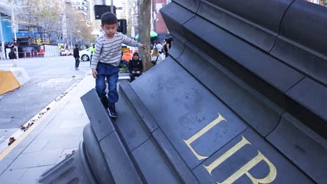 children playing on large outdoor sculpture