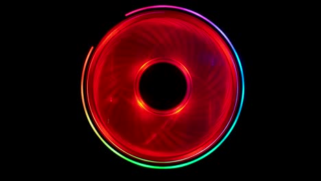 isolated circular central processing unit cooler spins around in neon colors