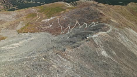 panoramic bird's eye view above truck and dirt road with switchbacks on the peak 10 trail breckenridge colorado