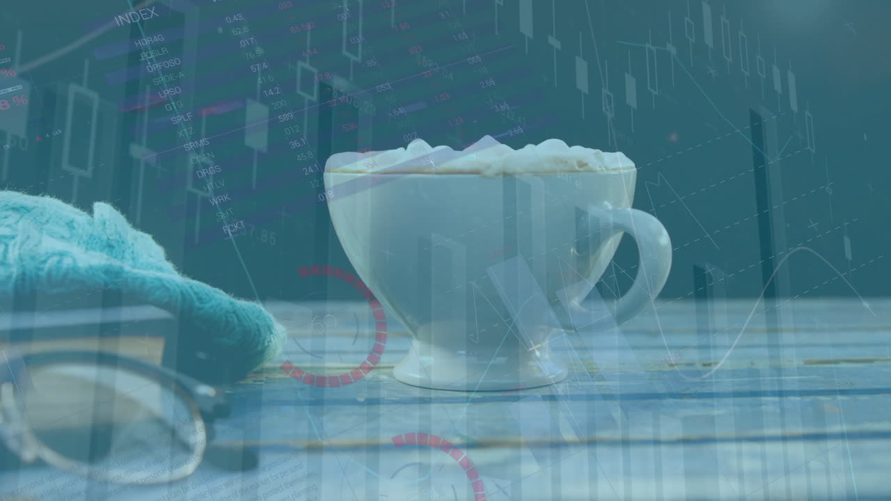 테이블 위에 커피 컵과 컵에 대한 금융 데이터 및 차트 애니메이션