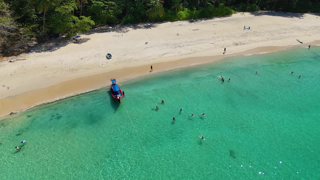 Tropical Beach with Tourists and Longtail Boat