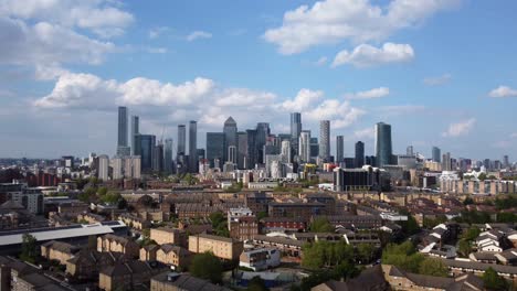 Drone-shot-of-residential-housing-estate-and-Canary-Wharf-in-London,-England