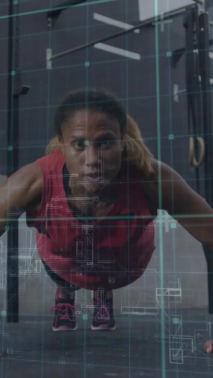 Vertical video: Woman doing pushup reps in gym, starting plank, cyan grid tracking form for fitness