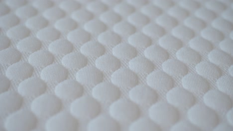 close-up of a white mattress with a bubble pattern