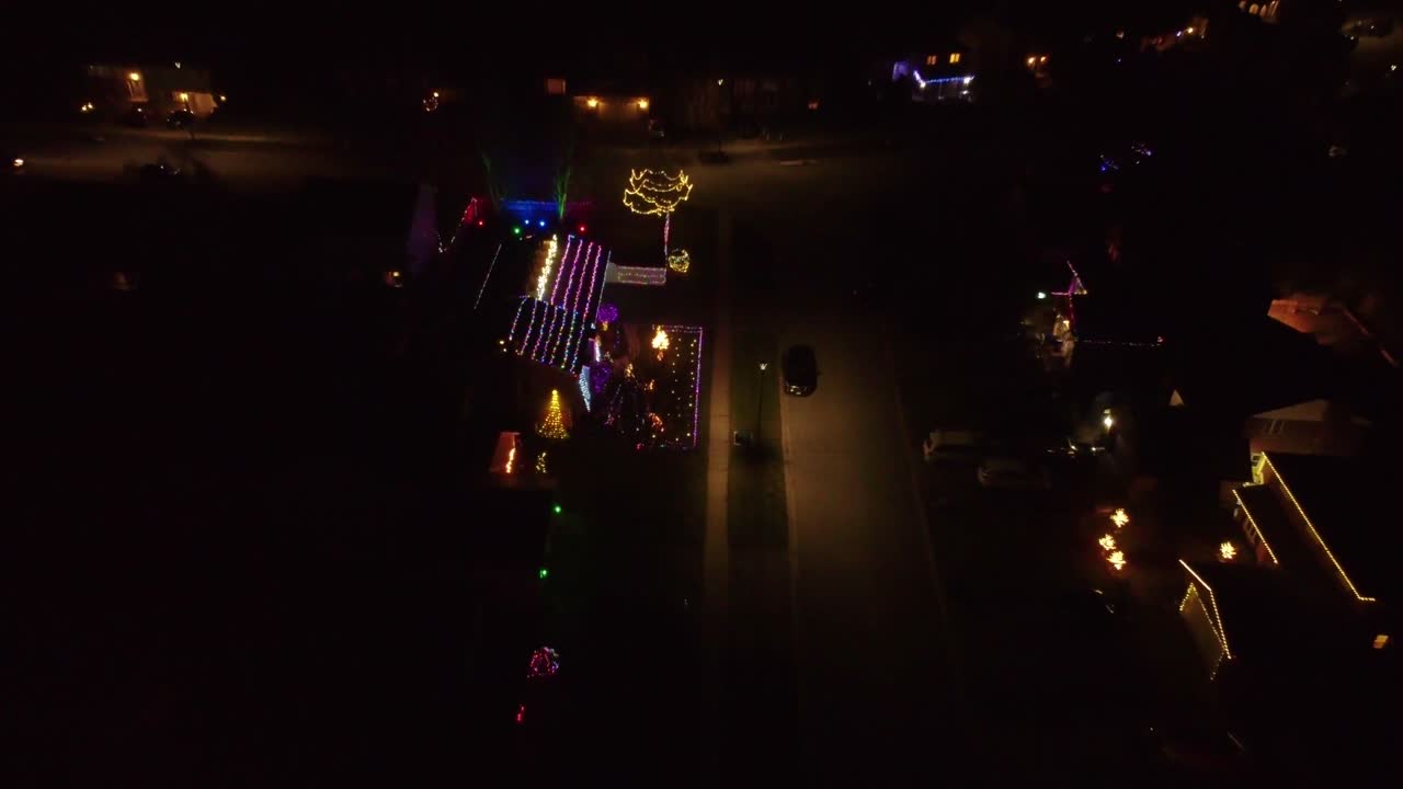 Christmas decorated homes in a city at night