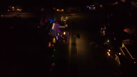 christmas decorated homes in a city at night