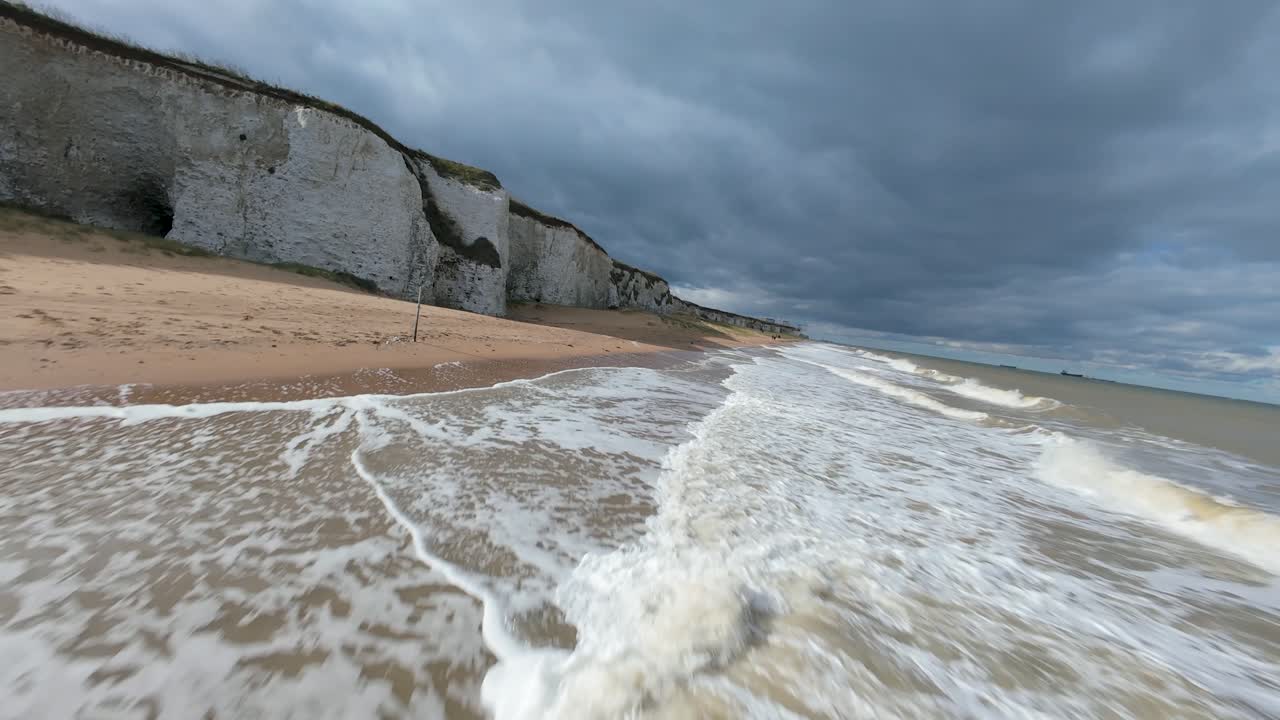 Natural geological wonders of the British coast, rock fromations at the sea. Carved and weathered by the elements over the milenia. FPV aerial action shots