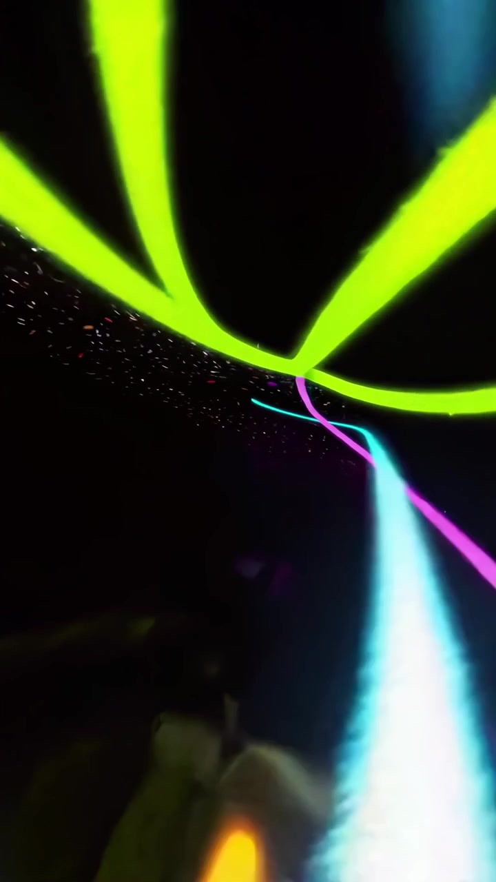 Abstract Neon Light Trails Moving in Dark Space
