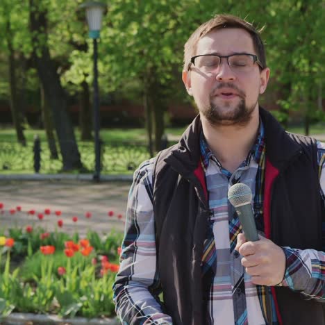 reporter speaks into a microphone