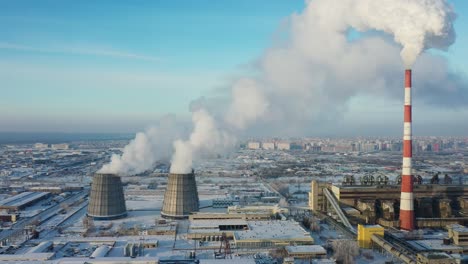 power plant in a snowy cityscape