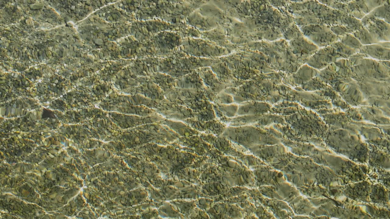 Peaceful morning in Geneva with the iconic Jet d’Eau rising from the lake, calm waters reflecting the clear sky, and the city slowly coming to life in the morning light.