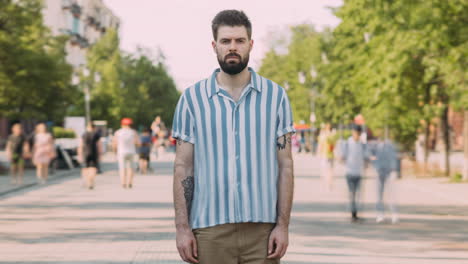 man standing on city street