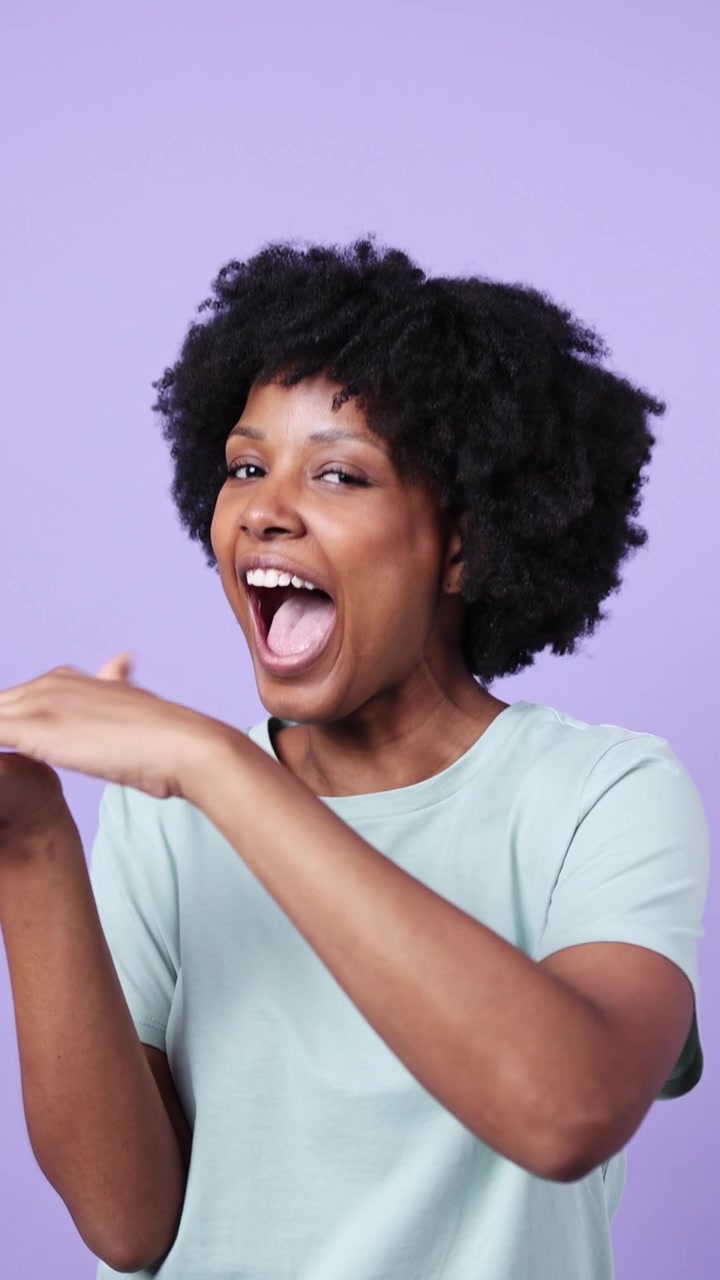 Happy Young Black Woman Winking and Gesturing Playfully