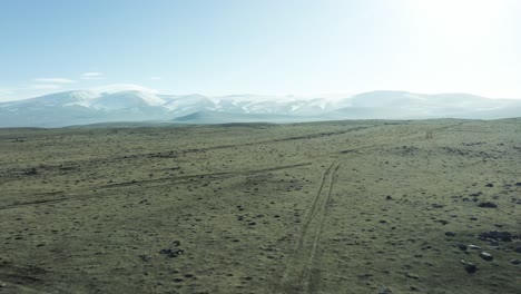 sweeping plain landscape with small pools near mountainscape in tsalka, georgia